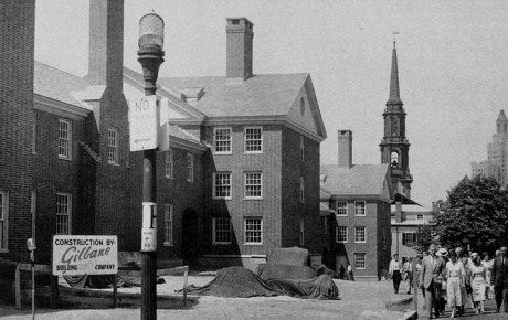 Archival image of Kenney Quad with onlookers in 1957.