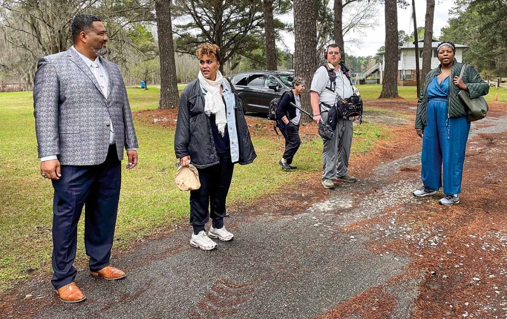 Image of participants on set of "the cost of inheritance" film.