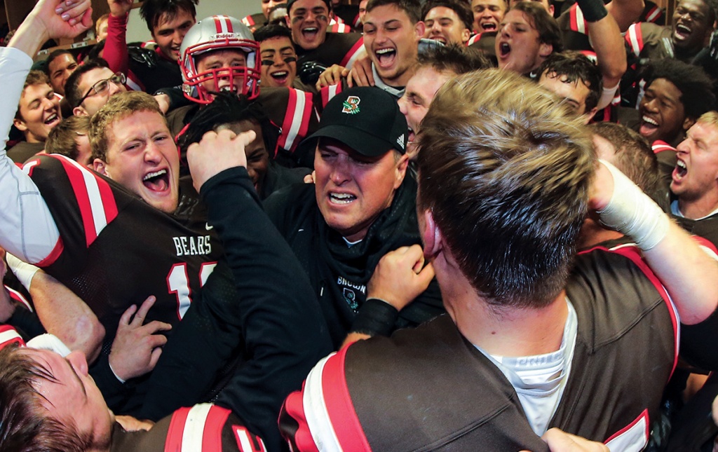 Estes and the Bears celebrate a win over URI at the 2015 Governor&rsquo;s Cup.