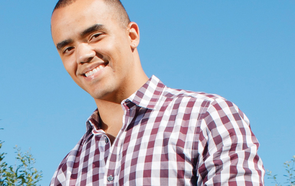 Photo of former Marine Michael Muir &rsquo;20 and his dog Sasha B. Muir enjoy their yard in North Providence. 