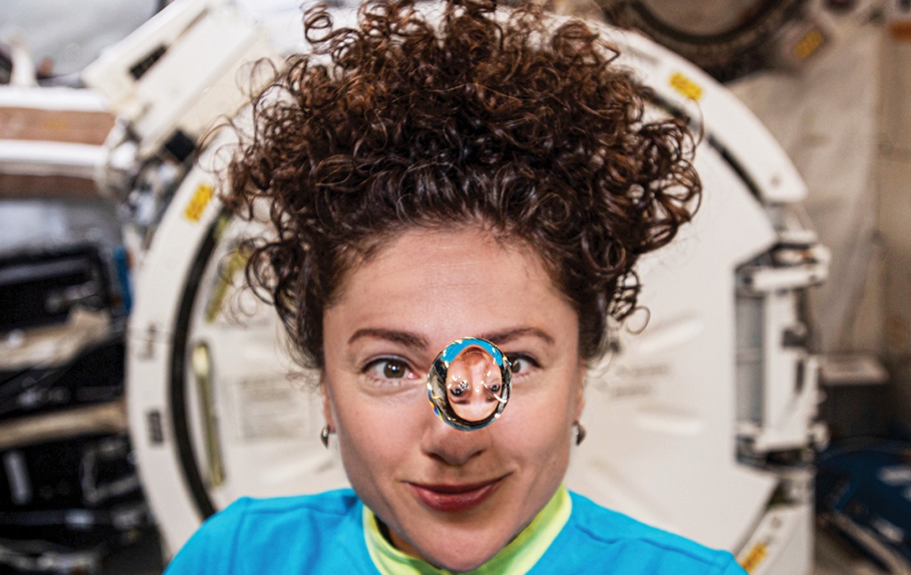 Jessica Meir &rsquo;99 plays with a water droplet in space